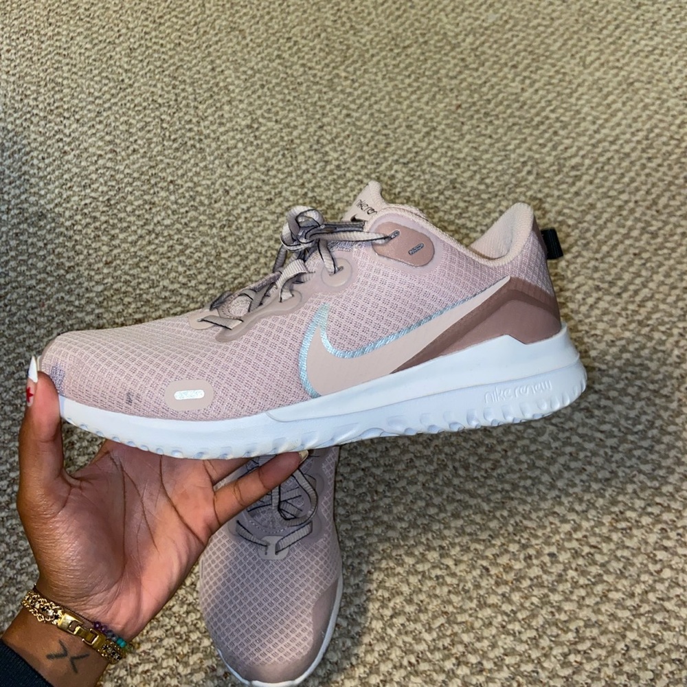 Blush pink Nike renew running shoes